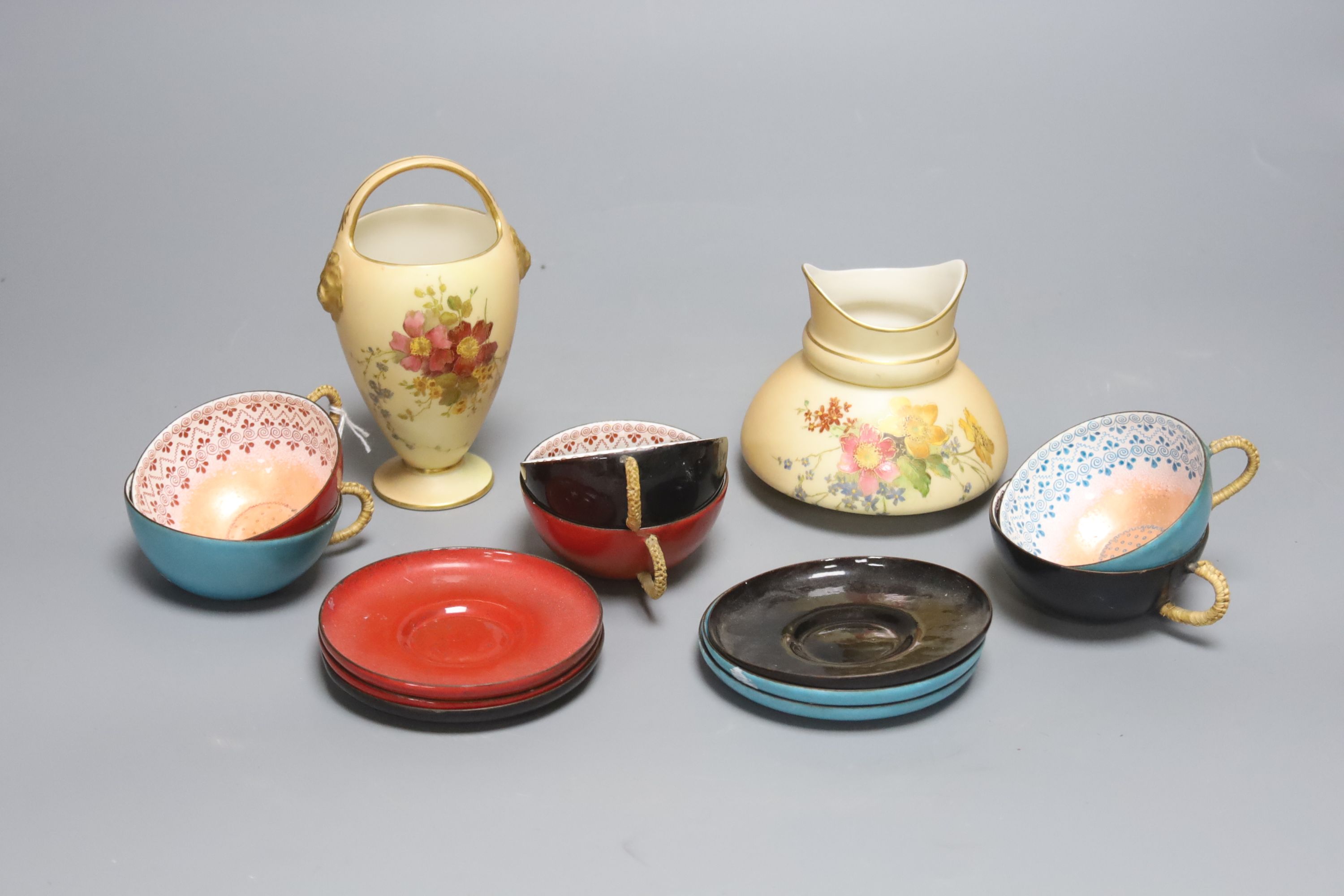 Two Royal Worcester blush pots and a set of six enamelled metal cups and saucers